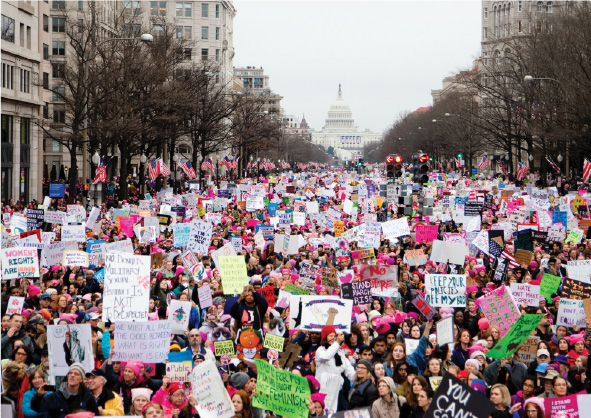 A large group of people protesting in Washington, DC